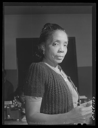 Chicago, Illinois. Ida B. Wells Housing Project. Mrs. Hallie L. Mills, editor of the Community News, the newspaper published by and for the tenants