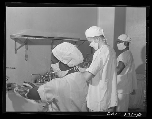 Chicago, Illinois. Provident Hospital. Interns and a nurse preparing to assist in an operation