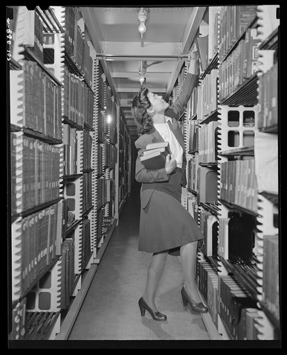Washington, D.C. Jewal Mazique [i.e. Jewel] working in the stacks of the Library of Congress