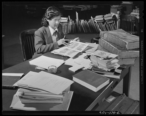 Untitled photo, possibly related to: Washington, D.C. Jewal Mazique [i.e. Jewel] on temporary duty cataloging in the rare book section of the Library of Congress