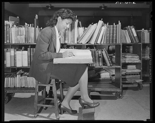 Untitled photo, possibly related to: Washington, D.C. Jewal Mazique [i.e. Jewel] on temporary duty cataloging in the rare book section of the Library of Congress