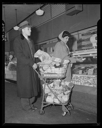 Untitled photo, possibly related to: Washington, D.C. Jewal Mazique [i.e. Jewel], worker at the Library of Congress, and her husband shopping