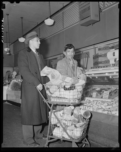 Untitled photo, possibly related to: Washington, D.C. Jewal Mazique [i.e. Jewel], worker at the Library of Congress, and her husband shopping