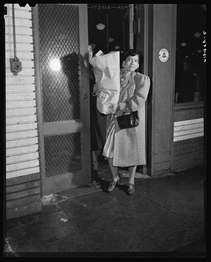 Untitled photo, possibly related to: Washington, D.C. Jewal Mazique [i.e. Jewel], worker at the Library of Congress, and her husband shopping