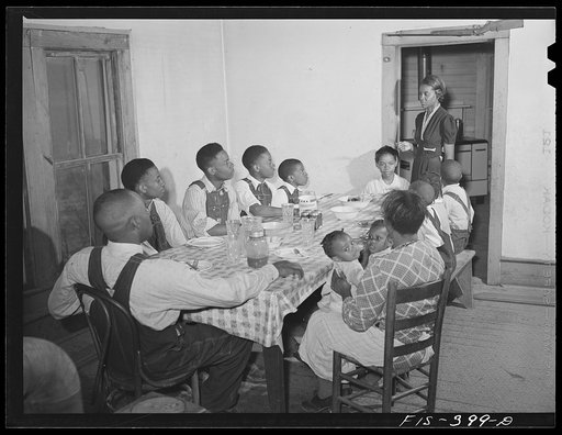 Untitled photo, possibly related to: Zebulon, North Carolina. Feggen Jones and family at dinner