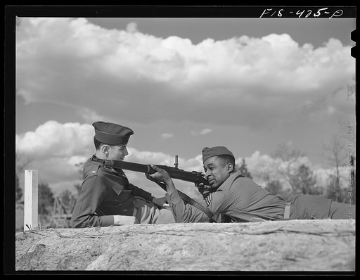 Untitled photo, possibly related to: Fort Bragg, North Carolina. Sergeant Williams showing a soldier how to shoot