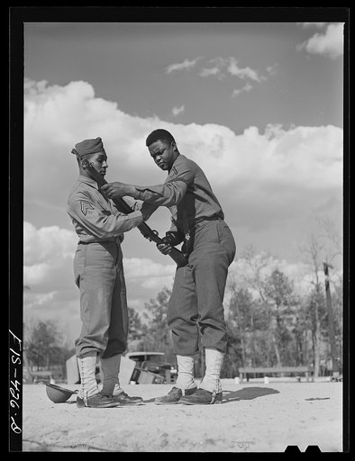 Fort Bragg, North Carolina. Sergeant Williams showing a soldier how to shoot