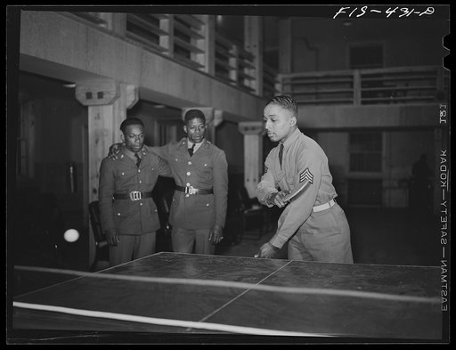 Fort Bragg, North Carolina. Sergeant Williams playing ping-pong in the service club