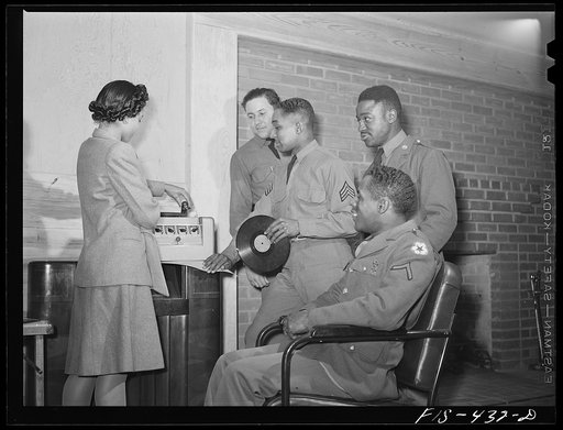 Untitled photo, possibly related to: Fort Bragg, North Carolina. Sergeant Williams with the USO (United Service Organization) hostess in a service club
