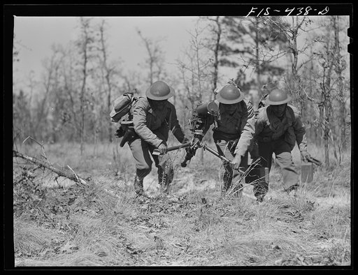 Untitled photo, possibly related to: Fort Bragg, North Carolina. Sergeant Williams leading a machine gun squad in a maneuver