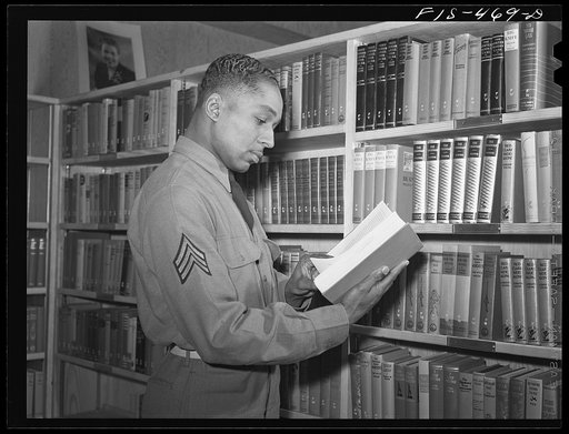Fort Bragg, North Carolina. Sergeant Williams in the library of the service club