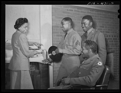 Fort Bragg, North Carolina. Sergeant Williams with the USO (United Service Organization) hostess in a service club