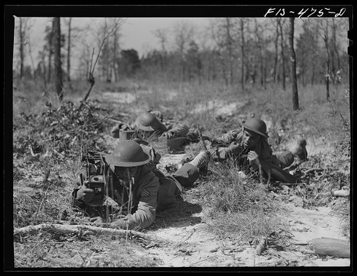 Fort Bragg, North Carolina. Sergeant Williams leading a machine gun squad in a maneuver
