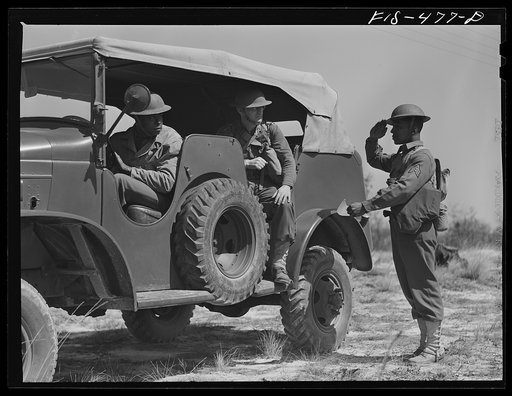 Untitled photo, possibly related to: Fort Bragg, North Carolina. Sergeant Williams delivering a message to an officer