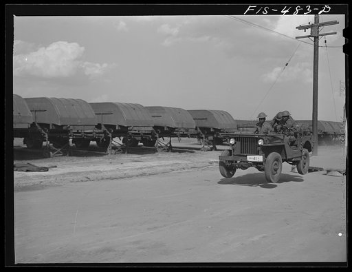 Untitled photo, possibly related to: Fort Bragg, North Carolina. Sergeant Franklin Williams, left, in jeep