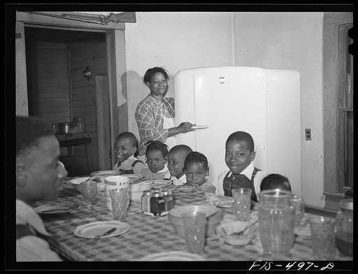 Untitled photo, possibly related to: Zebulon, North Carolina. Feggen Jones and family at dinner