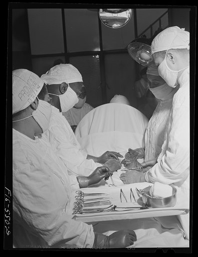 Chicago, Illinois. Provident Hospital. Doctors and interns at a (mock) operation