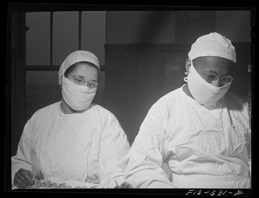 Chicago, Illinois. Provident Hospital. Doctor and a nurse at a (mock) operation