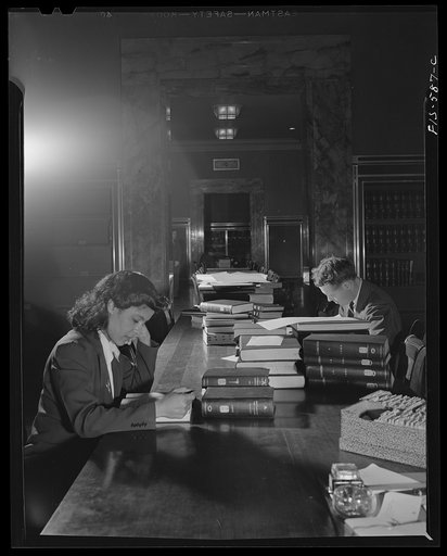 Untitled photo, possibly related to: Washington, D.C. Jewal Mazique [i.e. Jewel] on temporary duty cataloging in the rare book section in the Library of Congress