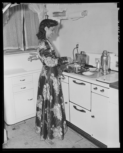 Untitled photo, possibly related to: Washington, D.C. Jewal Mazique [i.e. Jewel], worker at the Library of Congress, getting a late snack