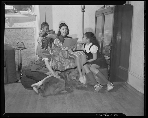 Washington, D.C. Jewal Mazique [i.e. Jewel], worker at the Library of Congress, reading to her young nieces