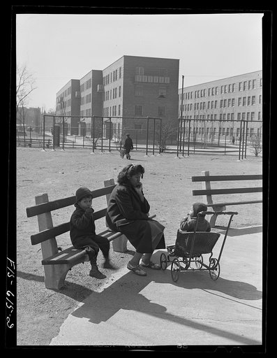 Chicago, Illinois. Ida B. Wells Housing Project. Mother and children in the playground
