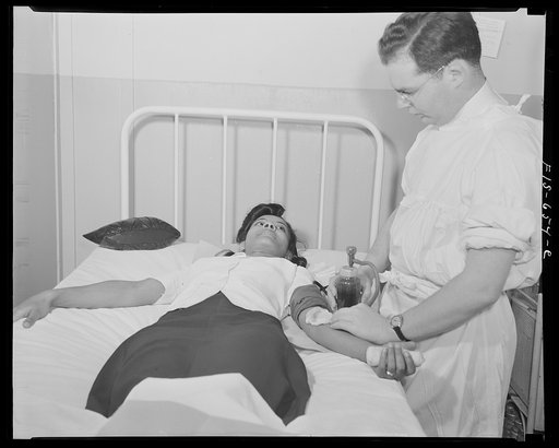Untitled photo, possibly related to: Washington D.C. Jewal Mazique [i.e. Jewel], worker at the Library of Congress, giving her blood for plasma