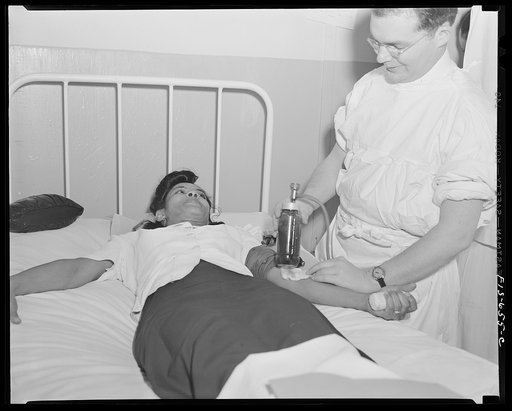 Untitled photo, possibly related to: Washington D.C. Jewal Mazique [i.e. Jewel], worker at the Library of Congress, giving her blood for plasma