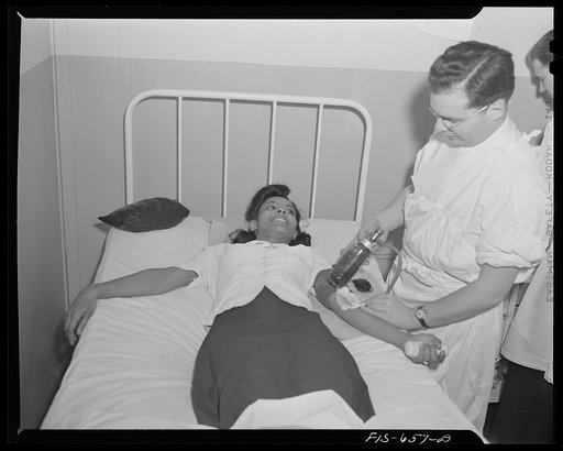 Untitled photo, possibly related to: Washington D.C. Jewal Mazique [i.e. Jewel], worker at the Library of Congress, giving her blood for plasma
