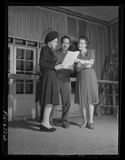 Chicago, Illinois. Good Sheperd Community Center. Two of the actors with Mr. Langston Hughes discussing the script of a new play during rehearsal