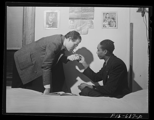 Untitled photo, possibly related to: Chicago, Illinois. Two of a group of young men who live cooperatively in a large house