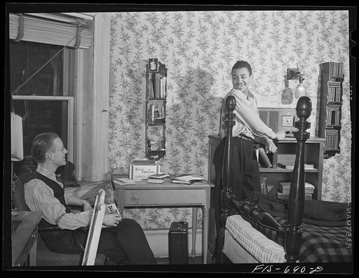 Chicago, Illinois. Two of a group of young men who live cooperatively in a large house