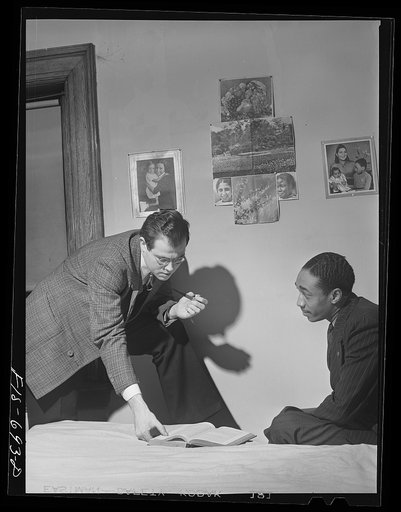 Chicago, Illinois. Two of a group of young men who live cooperatively in a large house