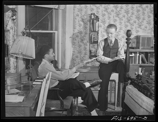 Chicago, Illinois. Two of a group of young men who live in cooperatively in large house