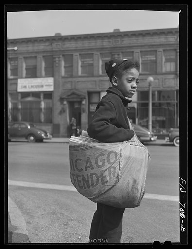 Untitled photo, possibly related to: Chicago, Illinois. Newsboy selling the Chicago Defender, a leading Negro newspaper