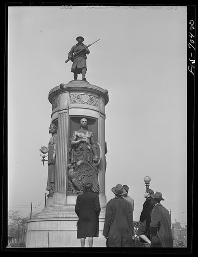 Untitled photo, possibly related to: Chicago, Illinois. High school students passing by the monument in honor of Negro soldiers killed in World War I