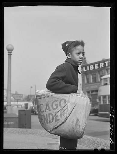 Untitled photo, possibly related to: Chicago, Illinois. Newsboy selling the Chicago Defender, a leading Negro newspaper
