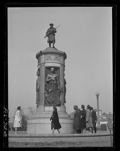 Chicago, Illinois. High school students passing by the monument in honor of Negro soldiers killed in World War I