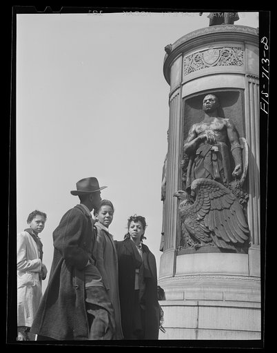 Untitled photo, possibly related to: Chicago, Illinois. High school students at the monument in honor of Negro soldiers killed in World War I