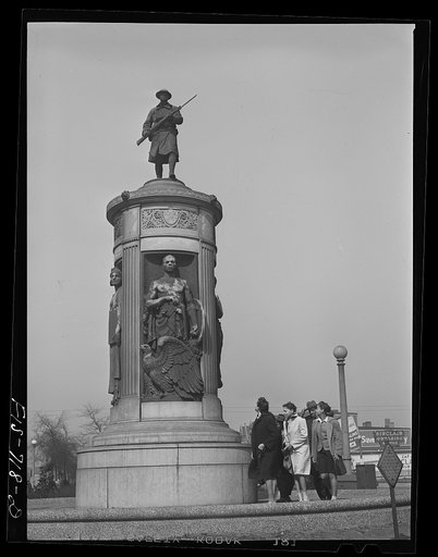 Untitled photo, possibly related to: Chicago, Illinois. High school students passing by the monument in honor of Negro soldiers killed in World War I