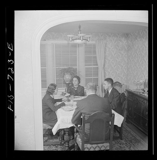 Washington, D.C. Negro family at dinner. The husband is a doctor, the wife a teacher, the son a student at Howard University, and the daughter in high school