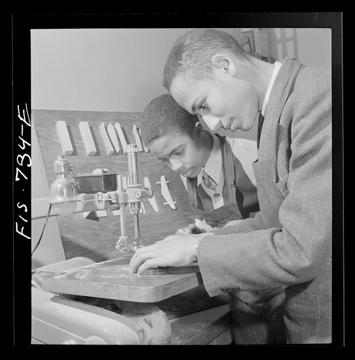 Untitled photo, possibly related to: Washington, D.C. Learning to use an electrical jigsaw to make model airplanes for the U.S. Navy at the Armstrong Technical High School