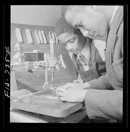 Washington, D.C. Learning to use an electrical jigsaw to make model airplanes for the U.S. Navy at the Armstrong Technical High School