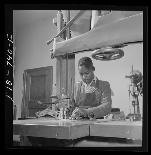 Washington, D.C. Using an electric drill to make model airplanes for the U.S. Navy at the Armstrong Technical High School