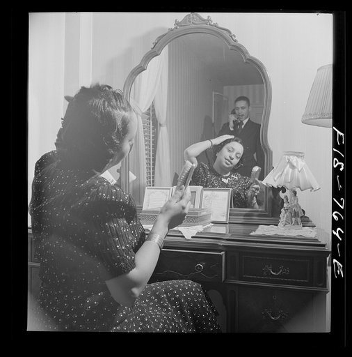 Untitled photo, possibly related to: Washington, D.C. Teacher in a Negro grammar school in her bedroom at home. Her husband is a doctor