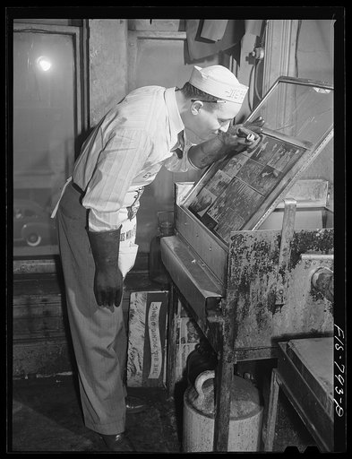 Chicago, Illinois. Engraver on the Chicago Defender, a Negro newspaper
