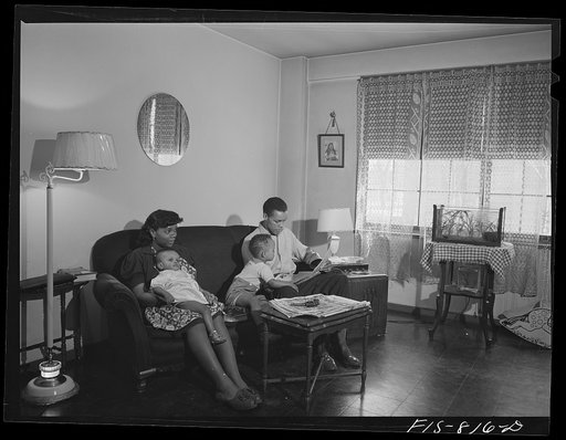 Chicago, Illinois. Ida B. Wells Housing Project. Family of Mr. Edward Vaughn living in one of the apartments. Mr. Vaughn is doing work for the War Department