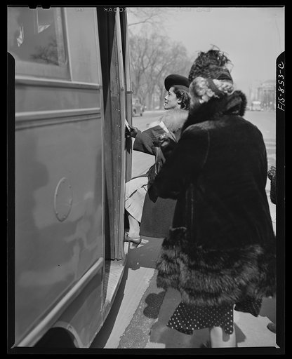 Untitled photo, possibly related to: Washington, D.C. Jewal Mazique [i.e. Jewel], worker at the Library of Congress, going home