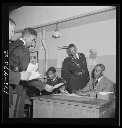 Untitled photo, possibly related to: Washington, D.C. Members of the military unit at the Armstrong Technical High School reporting to a regular army officer