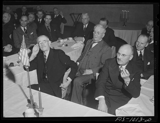 Minneapolis, Minnesota. On the left, former state senator Swanson and on the right Mr. H. E. Brandt, listening to Mr. Peterson's speech